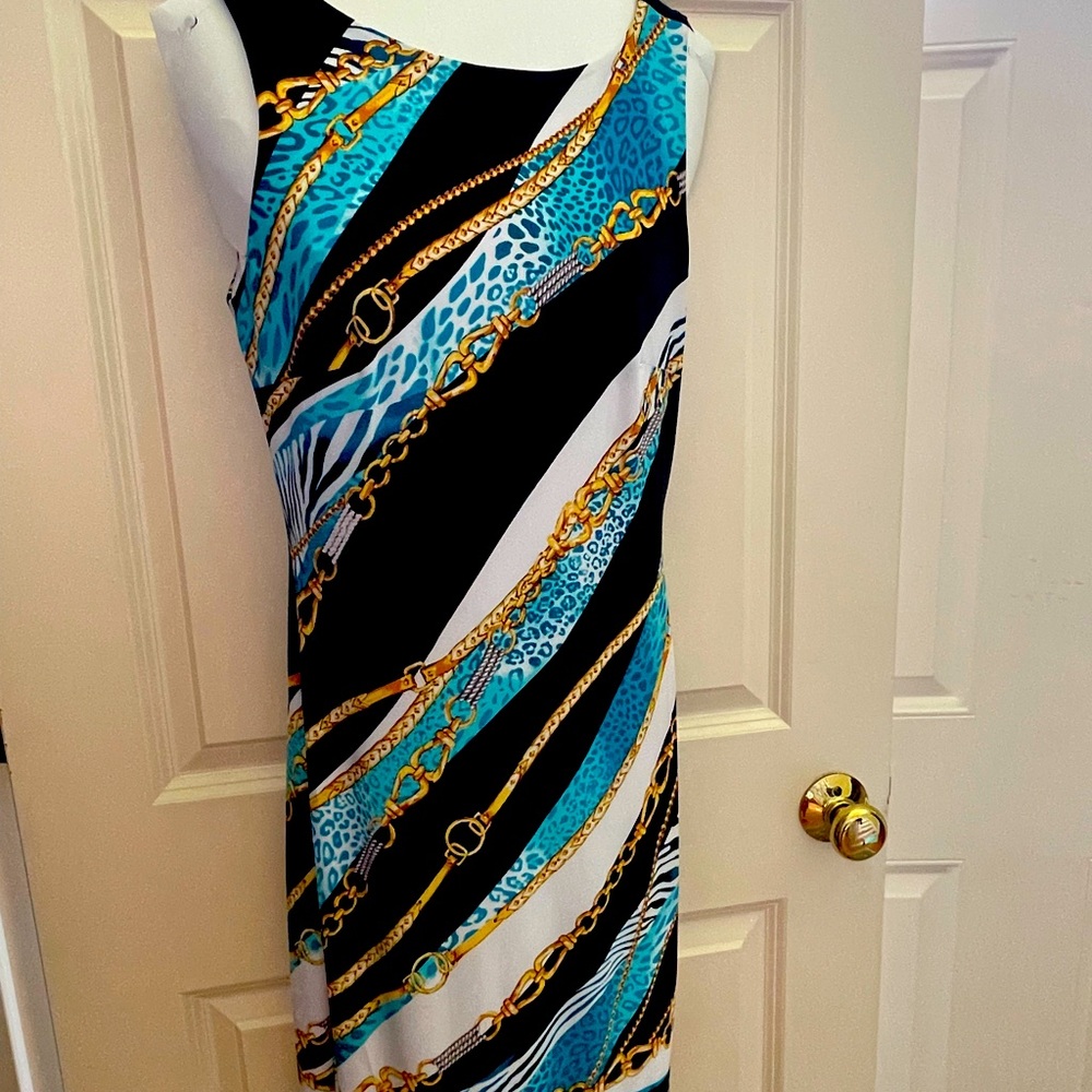 Cache. Seize 2. Fitted dress. Has some Spandex to provide stretch.